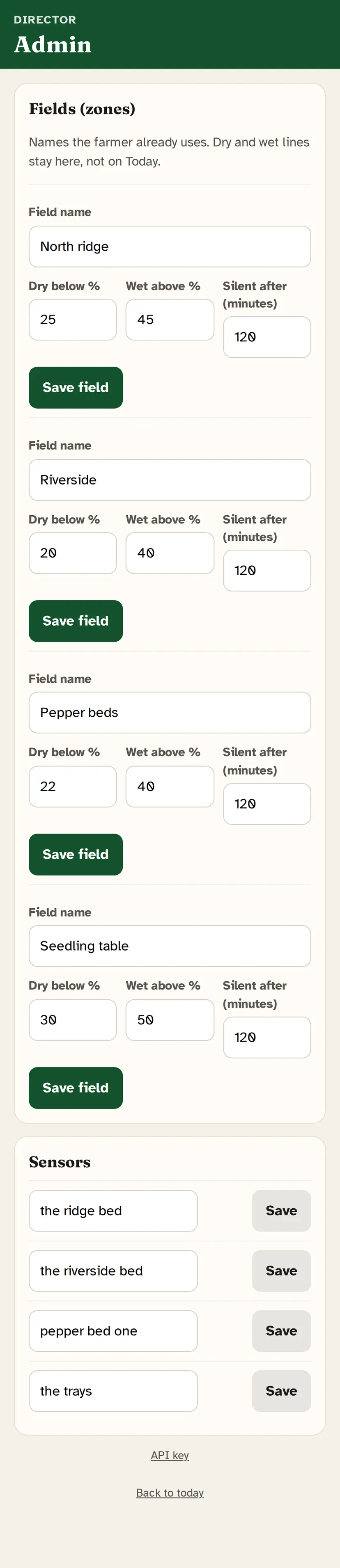 iPhone Field app, Admin. Field names North ridge, Riverside, Pepper beds, Seedling table, each with dry and wet lines. Sensor names the farmer already uses. This screen is for the director, not the morning tap list. Simulated farm.